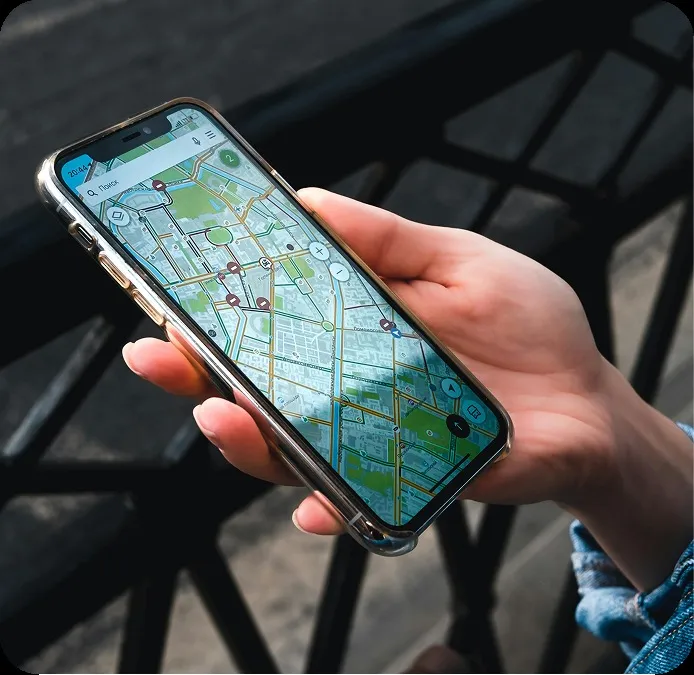 Smartphone navigation map representing travel platform omnichannel UI/UX design.